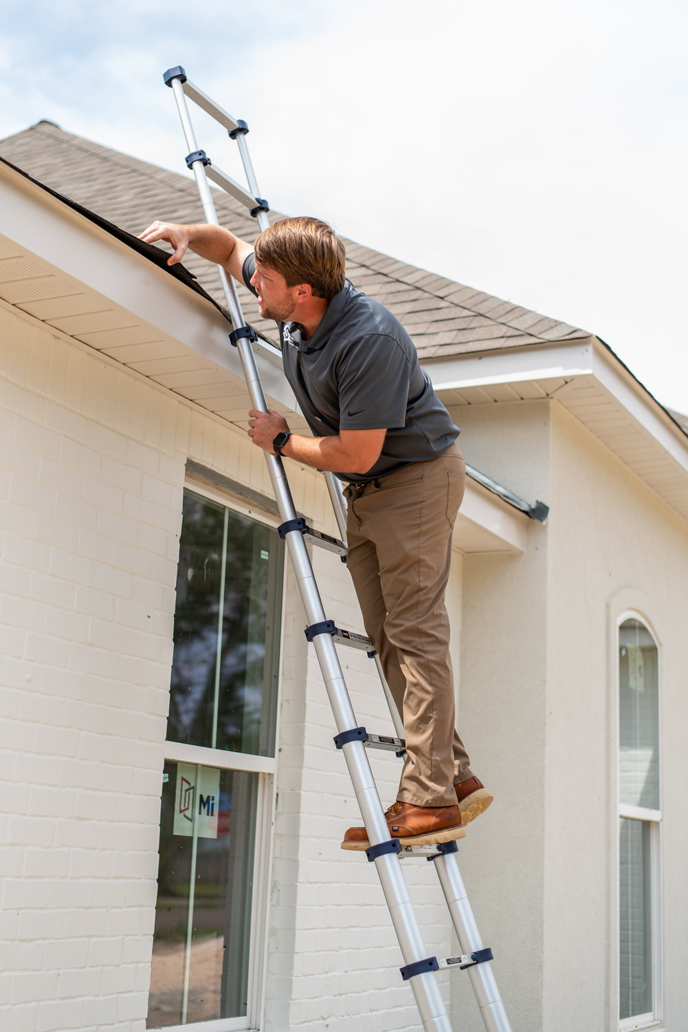 Boyce Yarbro inspecting the exterior of a Louisiana home