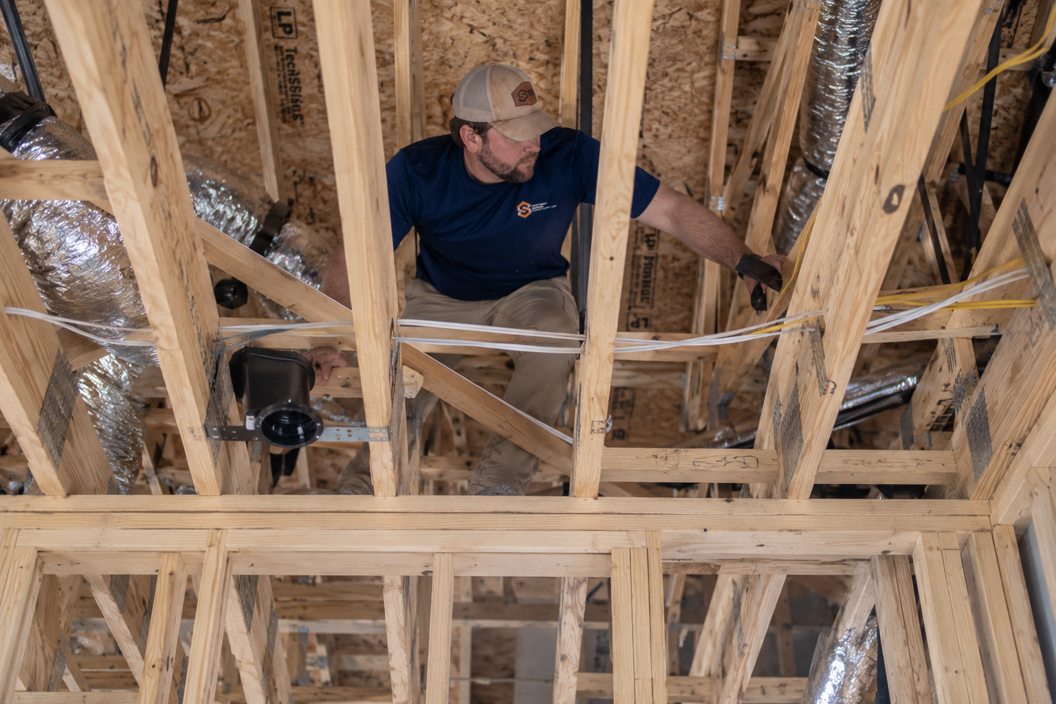 Boyce Yarbro inspecting framing and rough-in work in a new construction home